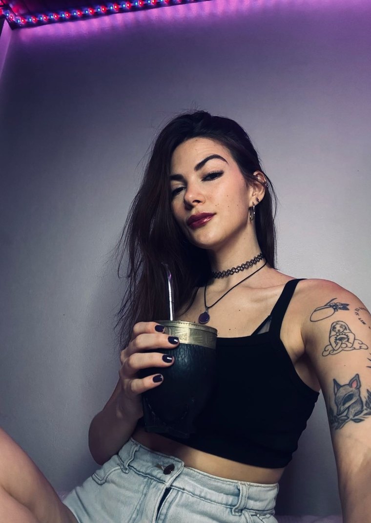 Paz, a Camlace performer, in neon light