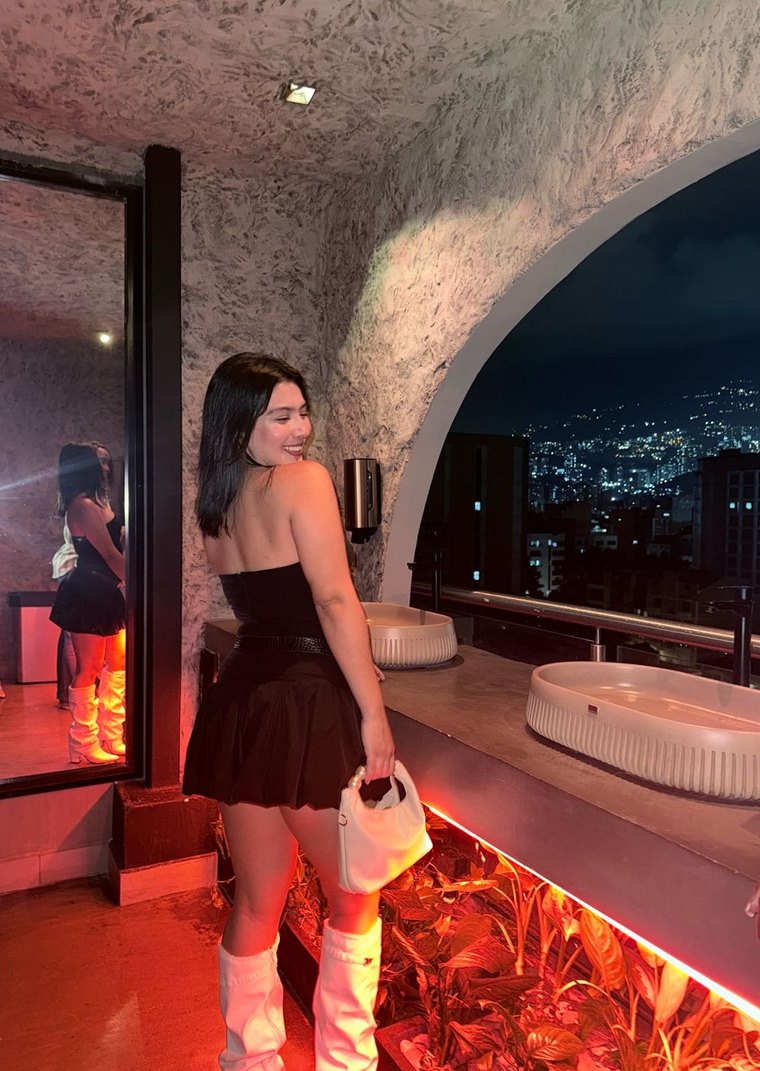 Samanta, a Camlace performer, on a night terrace