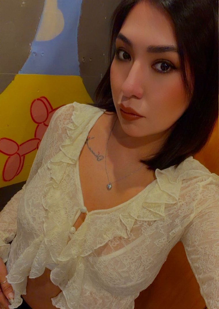 Paris, a Camlace performer, in white lace